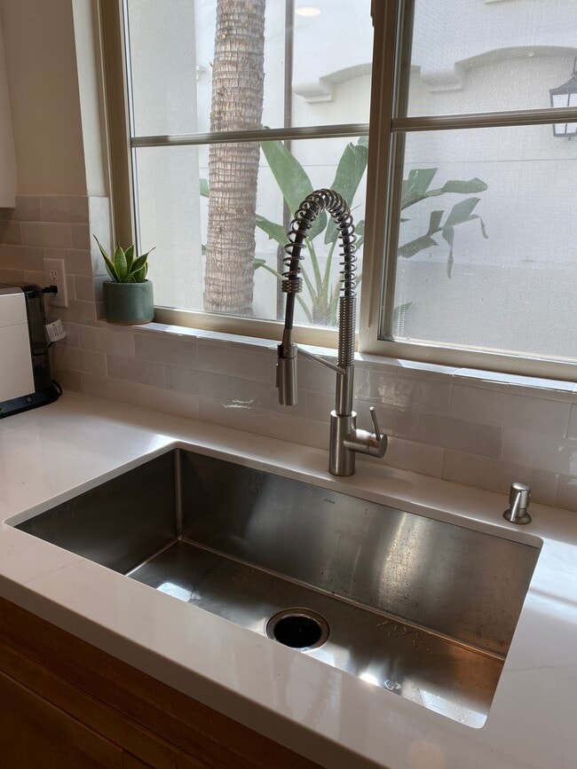 Brand new farm style stainless steel sink and pull down faucet - 1744 Grand Ave