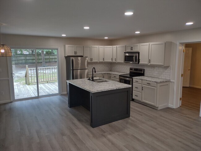Building Photo - Tastefully Upgraded Four Bedroom Brick Hom...
