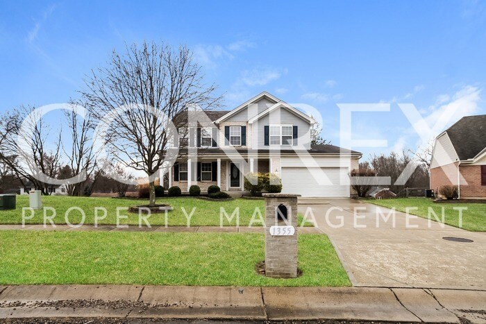 Primary Photo - Inviting 2-Story Home with Lovely Front Po...