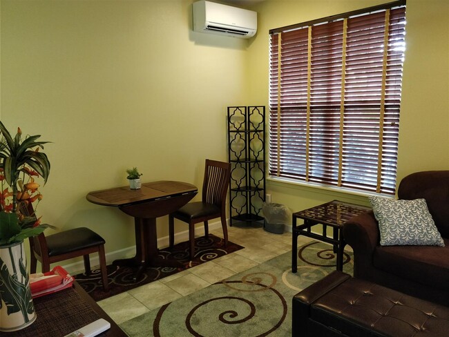 Living + Dining area now with tile and area rugs - 170 Kuli Puu St