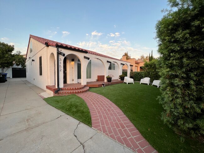 New turf front yard and fresh landscaping - 3152 Ivy St