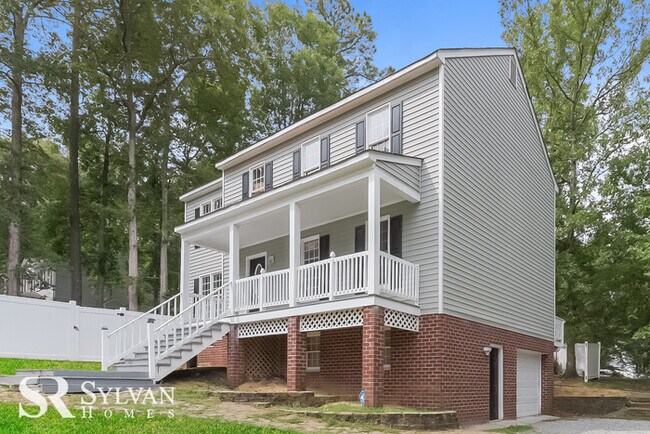 Building Photo - This spacious 4BR 2.5BA home features an o...
