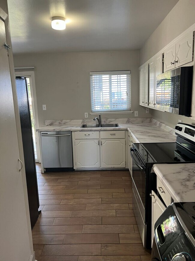 Building Photo - Centrally Located - Upgraded Appliances - ...