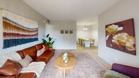 Located at 1805 Aquarena Springs Dr in San Marcos, TX, this well-designed one-bedroom, one-bathroom residence offers a thoughtfully organized single-floor layout. Light wood-style flooring runs throughout the main living areas, lending a clean, cohesive aesthetic that enhances the sense of openness.

The combined kitchen and living area forms the heart of the home. The kitchen features white cabinetry, white appliances including a refrigerator, electric range, built-in microwave, and a functional galley-style layout that maximizes efficiency. A dining area with a pendant chandelier sits adjacent, creating a natural flow between cooking and entertaining spaces. The living room benefits from a sliding glass door that invites natural light and provides outdoor views, complementing the airy, neutral color palette.

A hallway connects the main living space to the private bedroom, which is carpeted for comfort and includes a ceiling fan, a window with outdoor views, and a dedicated closet. The bedroom offers a calm, restful atmosphere well-suited for relaxation.

The bathroom is cleanly finished with white cabinetry, a single vanity with a large mirror, and a shower-tub combination. Throughout the home, the consistent use of light tones and practical finishes creates a welcoming and functional living environment.