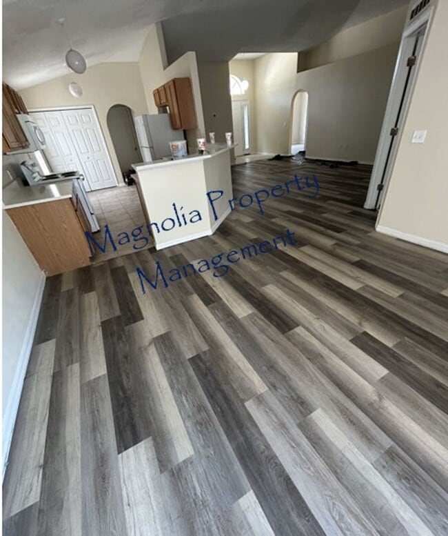 Building Photo - New Paint, Floors and Solid Surface Counte...