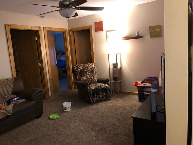 Living room. Bed 2 is left door, Bed 3 is middle door, Bath is right door - 1114 Cedar St