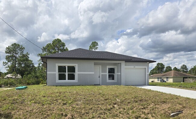 Building Photo - Brand New 2/2/1-South Lehigh Acres