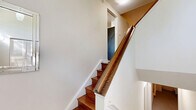 Located in the heart of Toronto's Davisville Village, this well-appointed 4-bedroom, 3-bathroom home spans three floors, offering generous living space with a thoughtful layout. Rich parquet flooring flows throughout the main living areas, adding warmth and character to the interior.

The main floor features an open-concept kitchen with dark wood cabinetry, light quartz countertops, a grey tile backsplash, and tile flooring — a contemporary and functional design. A peninsula counter connects seamlessly to the dining area, which enjoys natural light and access to a patio door framed by lush greenery. Two living rooms provide flexible entertaining and relaxation spaces, both featuring neutral tones and natural light.

The three bathrooms are finished with dark granite countertops, white cabinetry, and a mix of marble-look tile and mosaic accent walls, offering a clean, modern aesthetic. The primary bedroom is a comfortable retreat with a large window overlooking mature trees, parquet floors, and ample room for furnishings. The remaining three bedrooms are similarly bright, each featuring parquet flooring and natural light.

Three staircases and well-connected hallways ensure smooth circulation across all floors, while a utility room and closet add practical storage. This multi-floor home combines classic Toronto character with modern finishes throughout.