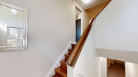 Located in the heart of Toronto's Davisville Village, this well-appointed 4-bedroom, 3-bathroom home spans three floors, offering generous living space with a thoughtful layout. Rich parquet flooring flows throughout the main living areas, adding warmth and character to the interior.

The main floor features an open-concept kitchen with dark wood cabinetry, light quartz countertops, a grey tile backsplash, and tile flooring — a contemporary and functional design. A peninsula counter connects seamlessly to the dining area, which enjoys natural light and access to a patio door framed by lush greenery. Two living rooms provide flexible entertaining and relaxation spaces, both featuring neutral tones and natural light.

The three bathrooms are finished with dark granite countertops, white cabinetry, and a mix of marble-look tile and mosaic accent walls, offering a clean, modern aesthetic. The primary bedroom is a comfortable retreat with a large window overlooking mature trees, parquet floors, and ample room for furnishings. The remaining three bedrooms are similarly bright, each featuring parquet flooring and natural light.

Three staircases and well-connected hallways ensure smooth circulation across all floors, while a utility room and closet add practical storage. This multi-floor home combines classic Toronto character with modern finishes throughout.