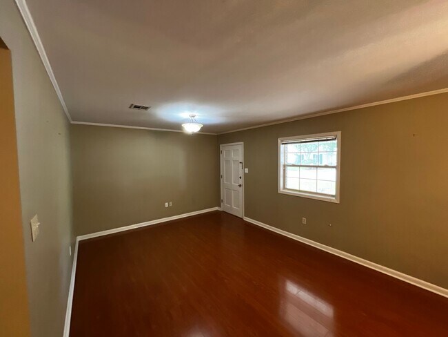 Building Photo - 3 Bedroom, 2 Bathroom, Brick home, Carport...