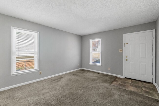 Building Photo - NE Home - Updated Kitchen and Bathrooms!  SS Appliances, Fire Place, Front Porch & Deck, Fenced Y...