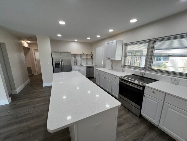 Building Photo - Rent this Newly Renovated and Spacious 4 Bedroom Home