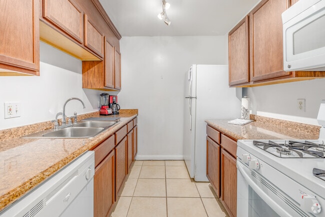 3BR, 2BA - 1,224SF - Kitchen - Country Village Apartments