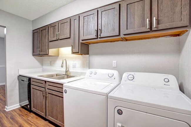 Kitchen and In-unit Washer & Dryer - Pinewood at National Hills Apartments