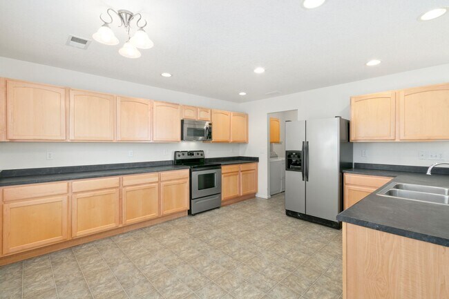 Building Photo - Large house on corner lot in The Meadows -...
