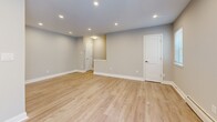This thoughtfully designed one-bedroom, one-bathroom residence in Lancaster, PA offers a clean, modern aesthetic throughout. The open-concept living and kitchen area is anchored by light wood-tone luxury vinyl flooring and recessed lighting, creating a bright and welcoming atmosphere. Large windows invite natural light into the living space, which also features baseboard heating and a wall-mounted HVAC unit for year-round comfort.

The kitchen is a standout feature, showcasing crisp white shaker-style cabinetry, granite-look countertops, a stainless steel undermount sink, and a full suite of stainless steel appliances including a gas range, over-the-range microwave, dishwasher, and refrigerator. The space is both functional and stylish, ideal for everyday cooking and entertaining.

The bedroom offers plush carpeting, a ceiling fan with light fixture, and a closet, providing a comfortable and restful retreat. The full bathroom is finished with tile flooring, a granite-topped vanity with shaker cabinetry, a mirrored medicine cabinet, and a tiled tub-shower combination, delivering a polished and practical design.

Throughout the residence, neutral gray walls, white trim, and consistent finishes create a cohesive and move-in-ready environment that balances modern style with comfortable living.
