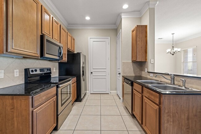 Gourmet kitchen with stainless steel appliances - Marquis at TPC