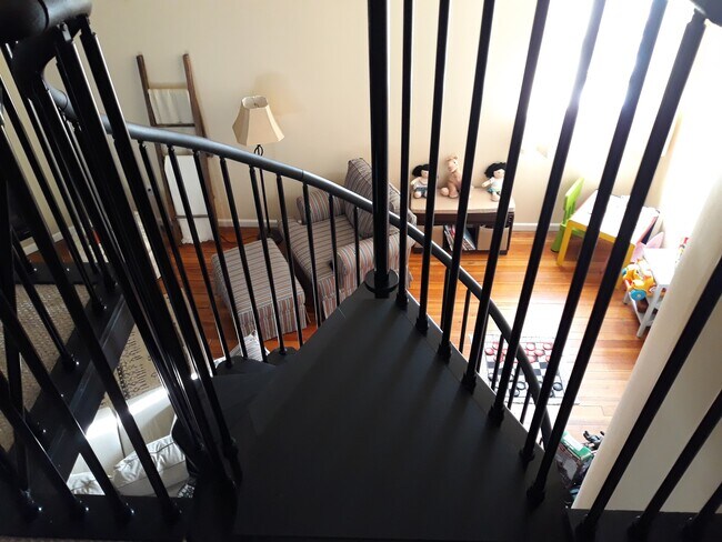 Master bedroom looking down from mezzanine - 208 East Main Street