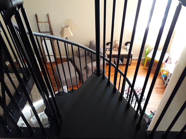 Master bedroom looking down from mezzanine - 208 East Main Street
