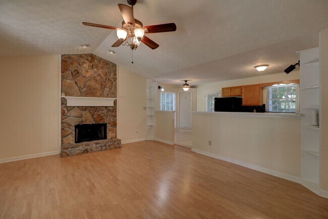 Open plan living room kitchen and breakfast nook. - 214 Sweetwater Circle