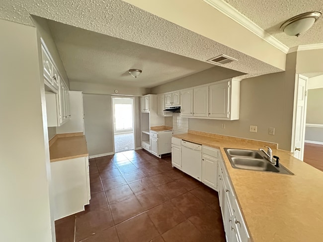 Building Photo - Grand 4BR/2BA Near Southwind | 2,438 Sq Ft, Stone Fireplace, Soaking Tub & 2-Car Garage