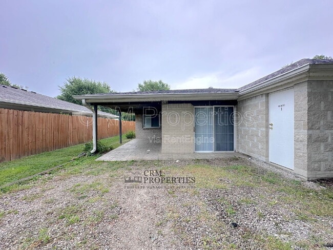 Photo - 9207 E 12th St Townhome