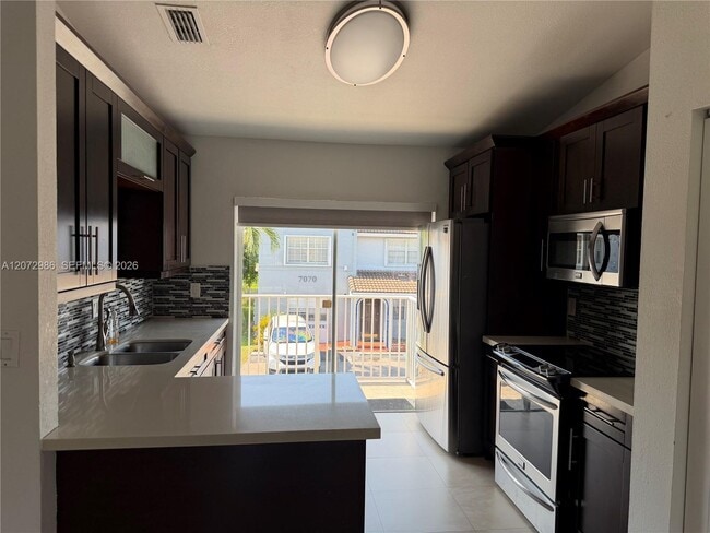 Building Photo - 7040 NW 173rd Dr