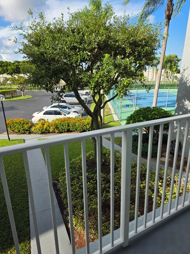 View when you step out side. Parking is where white car located - 2222 N Cypress Bend Dr