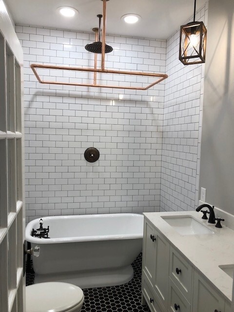 Large bathroom with restored bathtub and beautiful rain shower addition overhead - 1742 W Main St