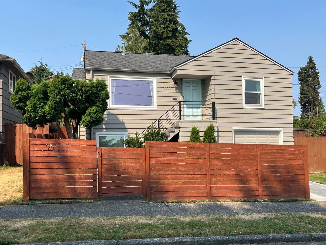 Primary Photo - Partial view updated Magnolia home on a qu...