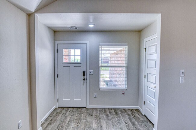 Building Photo - New Construction in Varenna Landing! Storm shelter and lawn care included!