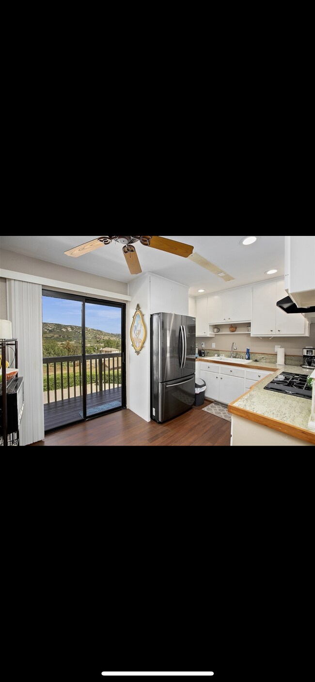 Kitchen with very large new refrigerator - 1035 Olive Ave