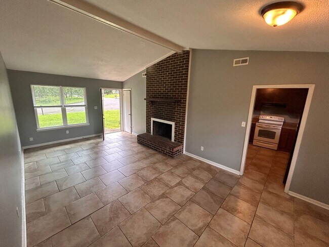 Building Photo - 3br 1BA house with decorative mantle and garage  with move in special for July!