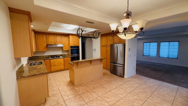 Huge dining room and large open kitchen with island and built in rack for pots and pans - 2107 Plant Ave