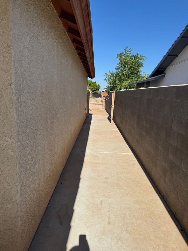 Building Photo - Enjoy this Fully Fenced San Luis Home
