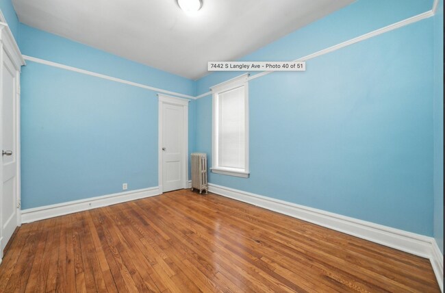 Building Photo - 7442 S Langley Ave