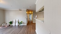 Located at 8300 Canyon St in Houston, TX, this single-floor, 2-bedroom, 2-bathroom home offers a well-designed layout with a neutral color palette and clean finishes throughout. The open-concept living area features warm wood-look flooring, crown molding, and a pass-through window connecting to the kitchen, creating a bright and cohesive common space. French doors in the living area fill the room with natural light and provide direct outdoor access. The kitchen is efficiently laid out with black appliances, including a refrigerator and range, ample counter space, and built-in shelving. Both bedrooms are carpeted and equipped with ceiling fans and windows that allow in natural light. The primary bedroom offers a comfortable layout with access to a dedicated closet. A walk-in closet with wire shelving provides generous storage. The primary bathroom includes a dual-sink vanity with modern cabinetry and a tub-shower combination, while the second bathroom mirrors this clean, functional design with its own tub-shower combo and hardwood-style flooring. A dedicated closet rounds out the storage options in this thoughtfully arranged home.