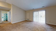 Located at 156 Somerset Ln in Avon Lake, Ohio, this single-floor home offers a thoughtfully designed layout that balances comfort and functionality. The open-concept living area is a standout feature, boasting vaulted ceilings that lend a sense of spaciousness and airiness to the space. Warm, neutral-toned carpet flows throughout the living and bedroom areas, while sliding glass doors flood the living room with natural light and provide access to the outdoors.

The galley-style kitchen is well-appointed with white cabinetry, ample counter space, and a full suite of white appliances including a gas range, refrigerator, and built-in microwave. Warm hardwood-style flooring runs through the kitchen, and a convenient in-unit laundry area is positioned just off this space.

The bedrooms are generously sized, each featuring plush carpeting, large windows that invite natural light, and ceiling-mounted light fixtures. The primary bedroom includes multiple closets for ample storage. Two full bathrooms serve the home, each featuring a tub-shower combination and hardwood-style flooring, maintaining a clean and cohesive aesthetic throughout. The overall ambiance is bright, neutral, and move-in ready, offering a comfortable living environment in a residential Avon Lake neighborhood.