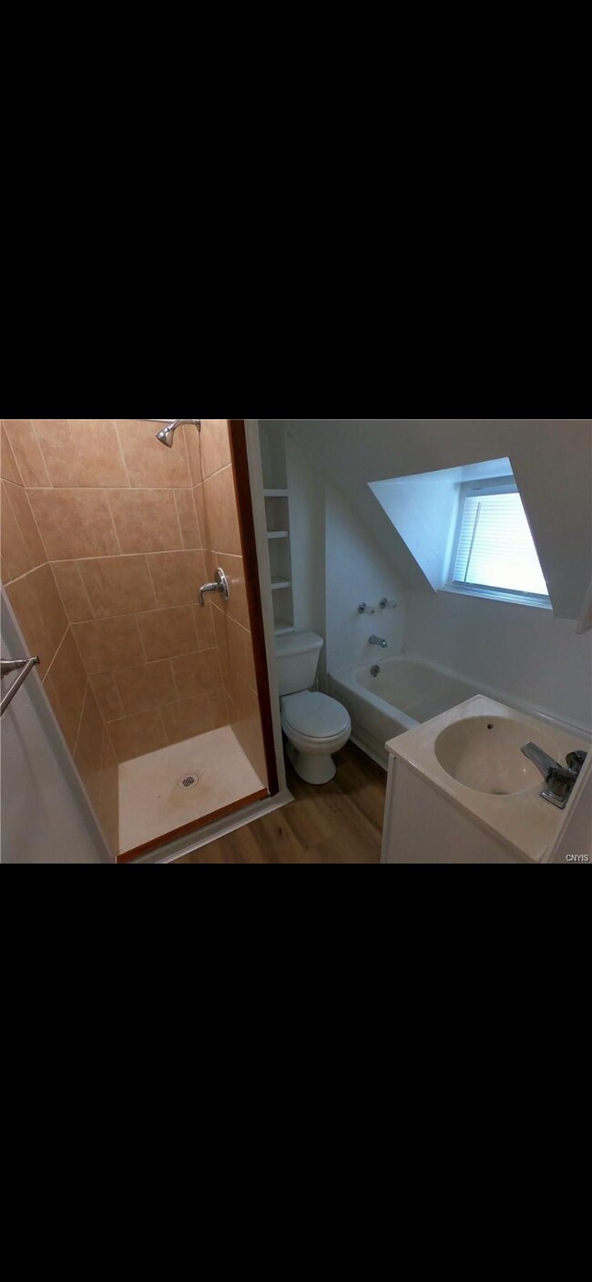 Bathroom with stand in shower and bathtub - 650 Emerson St