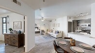Located at 1001 East Playa Del Norte Drive in Tempe, Arizona, this thoughtfully designed 2-bedroom, 3-bathroom residence offers a functional and modern living experience across a single floor. Wood-style flooring flows throughout, complementing the clean, neutral color palette that gives the space a bright and airy feel.

The open-concept living and dining area forms the heart of the home, with a ceiling fan overhead and seamless access to a private balcony through large sliding glass doors that invite natural light. The kitchen features dark cabinetry, stainless steel appliances, track lighting, and a peninsula with a white quartz countertop and undermount sink — ideal for both everyday cooking and casual dining.

The primary bedroom is a comfortable retreat, complete with a ceiling fan, large windows, and direct access to the balcony. The second bedroom also features a ceiling fan and ample natural light. Each of the three bathrooms is well-appointed, with one showcasing a dark-cabinetry vanity with a wide mirror, white quartz countertop, and a full tub-shower combination with tile surround.

Throughout the residence, the consistent use of light tones, wood-look flooring, and modern fixtures creates a cohesive and inviting atmosphere suited for everyday living in the heart of Tempe.
