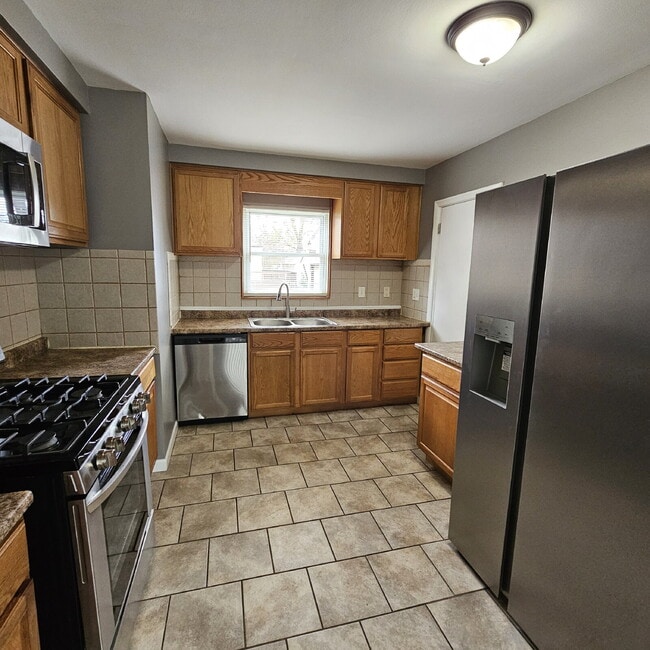Building Photo - 3 Bedroom Updated Brick Ranch w/ 2 Car Attached Garage, Basement, Kitchen w/ All Stainless-Steel ...