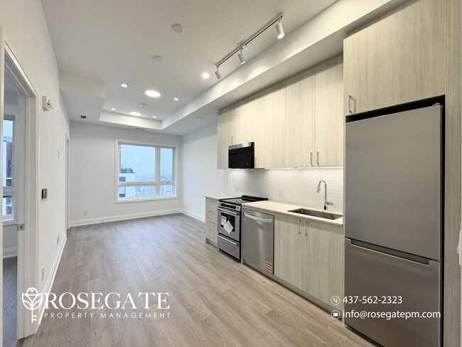 Building Photo - Modern 1 Bedroom + Den (Potential 2nd Bedroom) Condo with Parking & Balcony