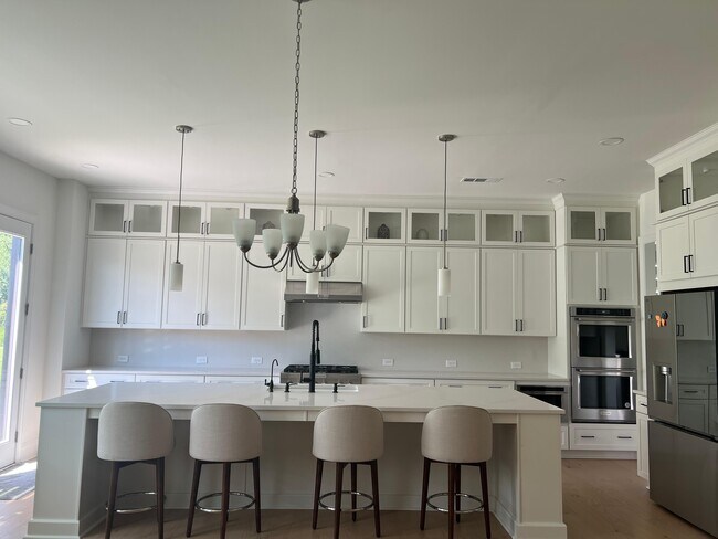 luxury kitchen with to the ceiling cabinets - 6490 Pond View Dr