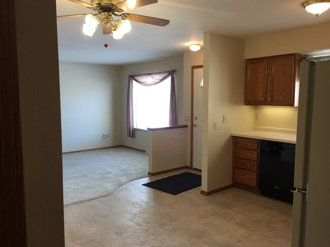 Kitchen and living room from rear entrance - 3780 Summerset Way