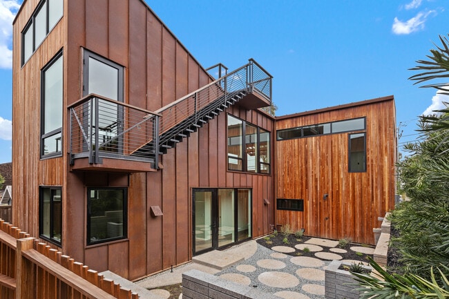 Outside of home facing west. Stairs to roof deck. - 4640 Del Monte Ave