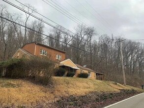 Building Photo - 6037 Poketa Rd