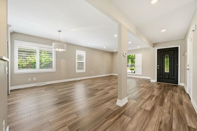 Building Photo - Spacious 4BR Home with Finished Basement, Private Yard & Community Amenities