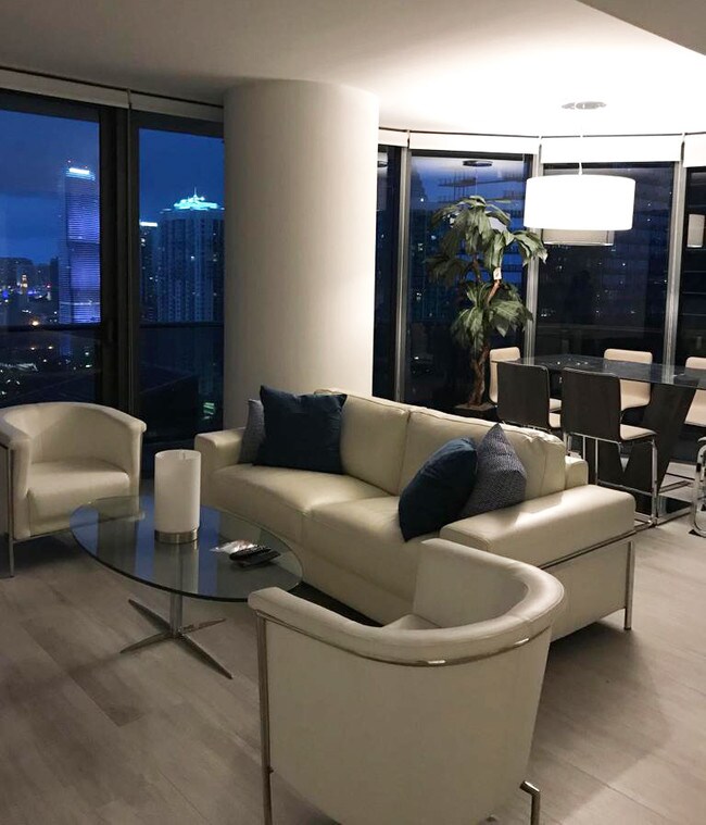 Living room with skyline views. - 55 SW 9th St