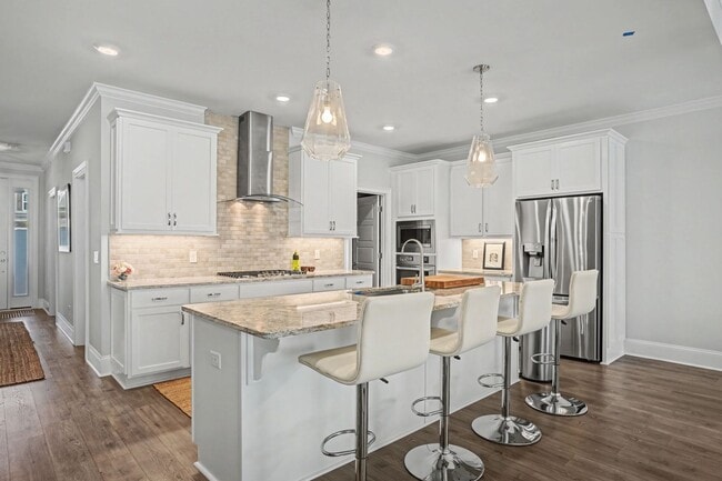 Building Photo - 3 BED | 3.5 BATHS | TWO CAR GARAGE | HERB RIVER | FURNISHED TOWNHOME