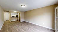 Located at 3629 Montreal Creek Cir in Clarkston, Georgia, this two-floor residence offers a practical and comfortable layout with consistent finishes throughout. The main living area is finished with durable wood-look flooring and neutral warm-beige walls, creating a bright and welcoming atmosphere. A textured ceiling adds subtle architectural character throughout the space. The living room opens to the outdoors via a glass-paneled door, allowing natural light to filter in and providing convenient exterior access.

The galley-style kitchen is efficiently designed with white cabinetry lining both sides, white countertops, a stainless steel sink, and black appliances including a range and refrigerator. A door off the kitchen provides additional interior access.

The bedrooms are carpeted for added comfort and receive natural light through multiple windows. Each bedroom includes closet access and ample wall space. The two full bathrooms each feature a tiled tub-shower combination, toilet, and vanity. One bathroom is finished with wood-look flooring, while the other includes a textured accent wall that adds visual interest.

Clean white baseboards and flush-mount light fixtures are consistent throughout the home, contributing to a cohesive and well-maintained aesthetic across both floors.